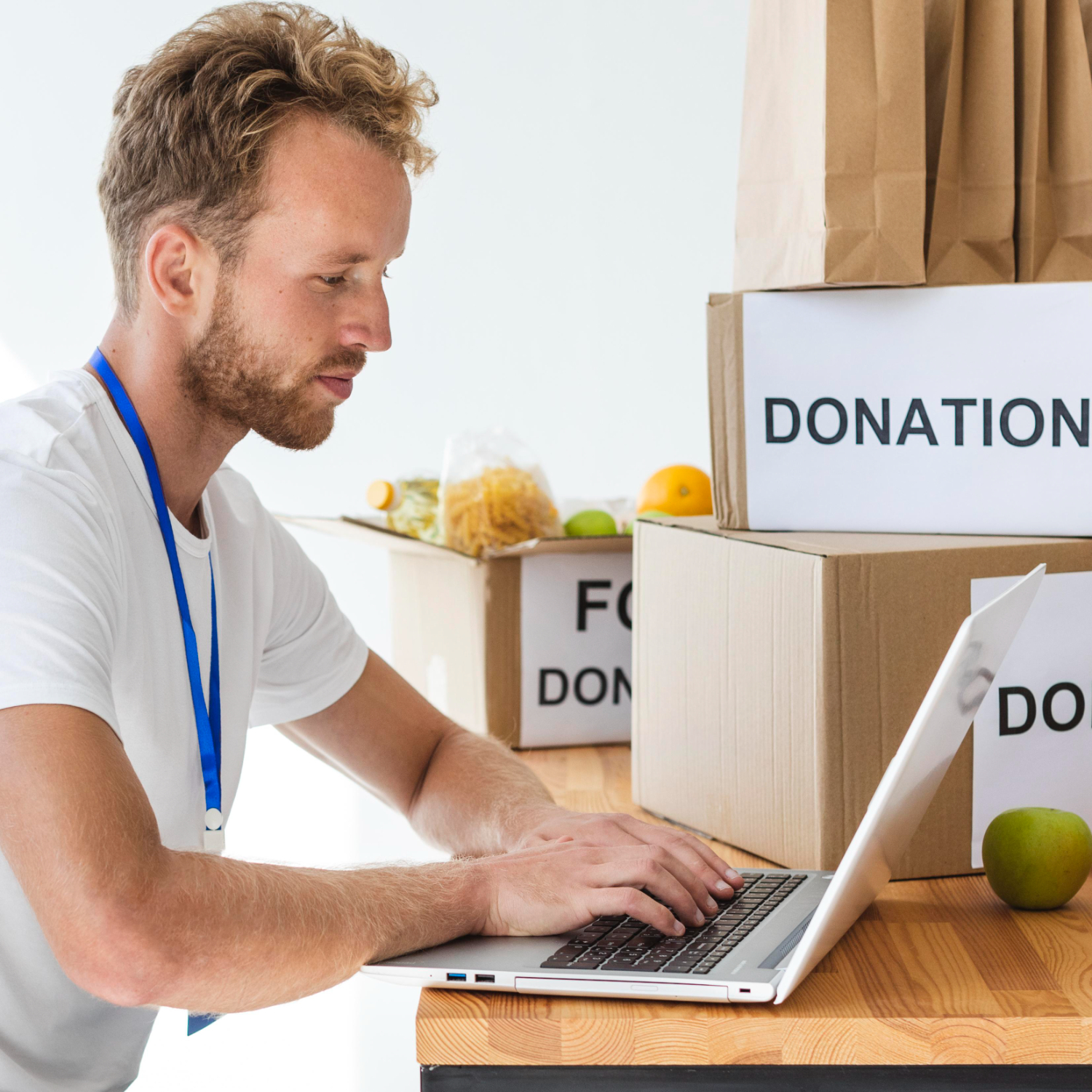 volunteer-uses-laptop-nonprofits-heberlein-falk