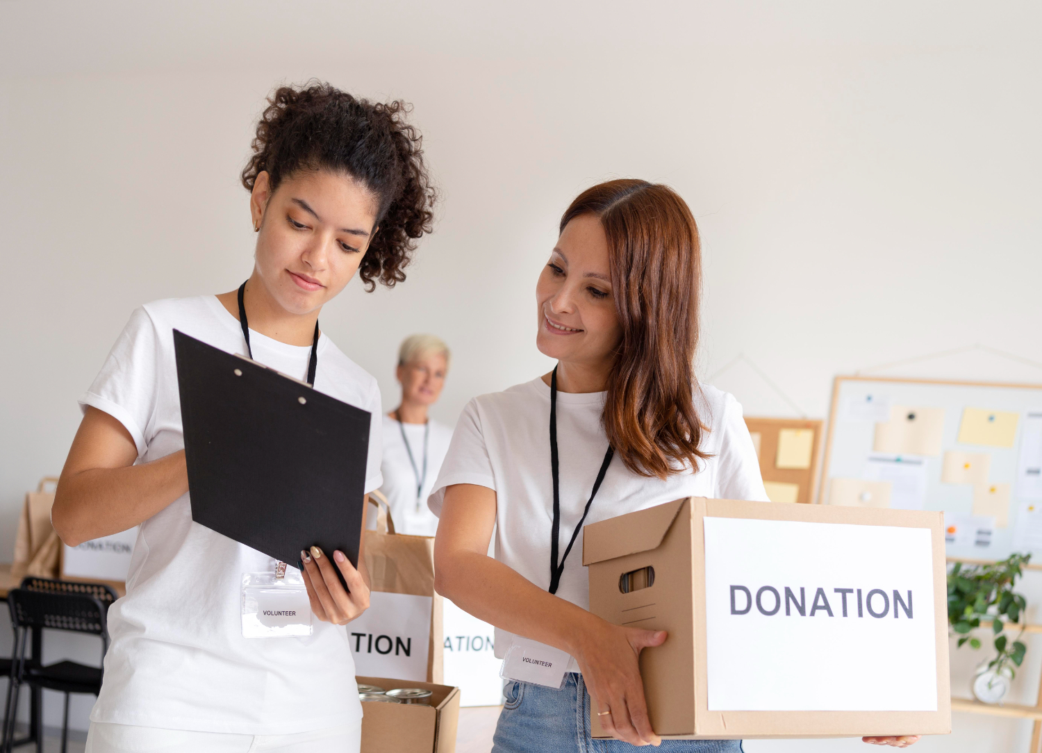 two-volunteers-look-over-documents-hf