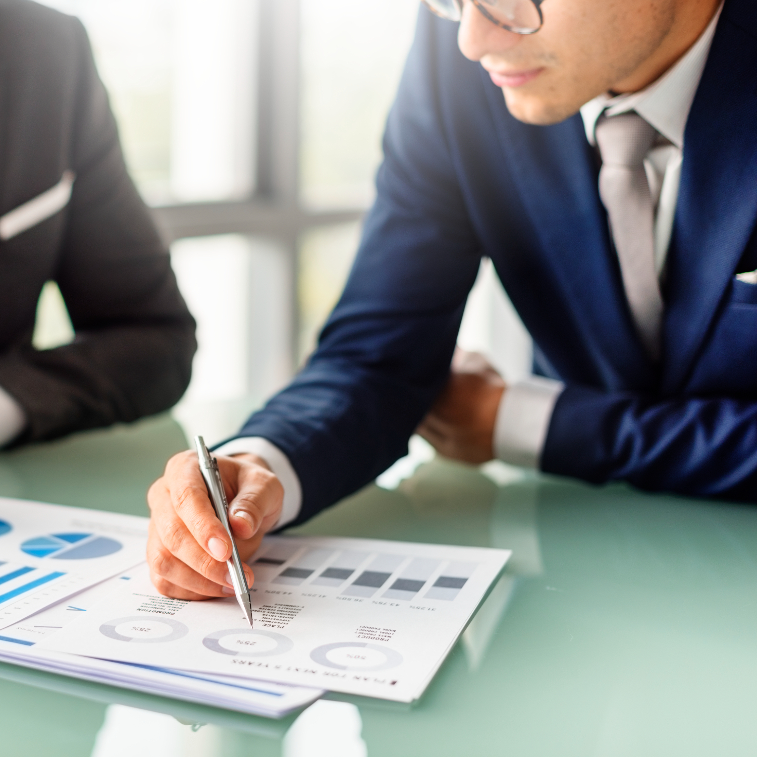 businessman-reading-financial-documents-heberlein-and-falk